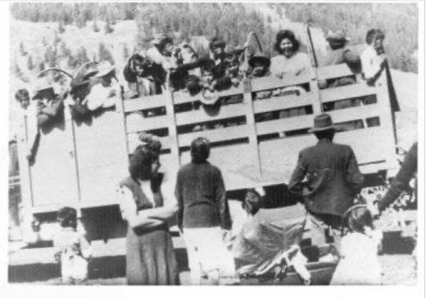 Children in the back of a cattle car on their way to residential school