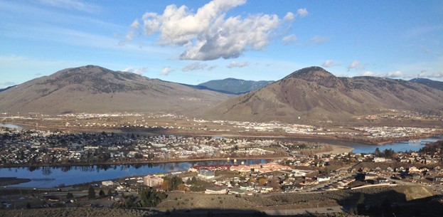View from Thompson Rivers University, overlooking the city of Kamloops facing towards the North. Confluence of the North and South Thompson Rivers, and skyline between Mount Peter, Mount Paul, and Strawberry Hill.